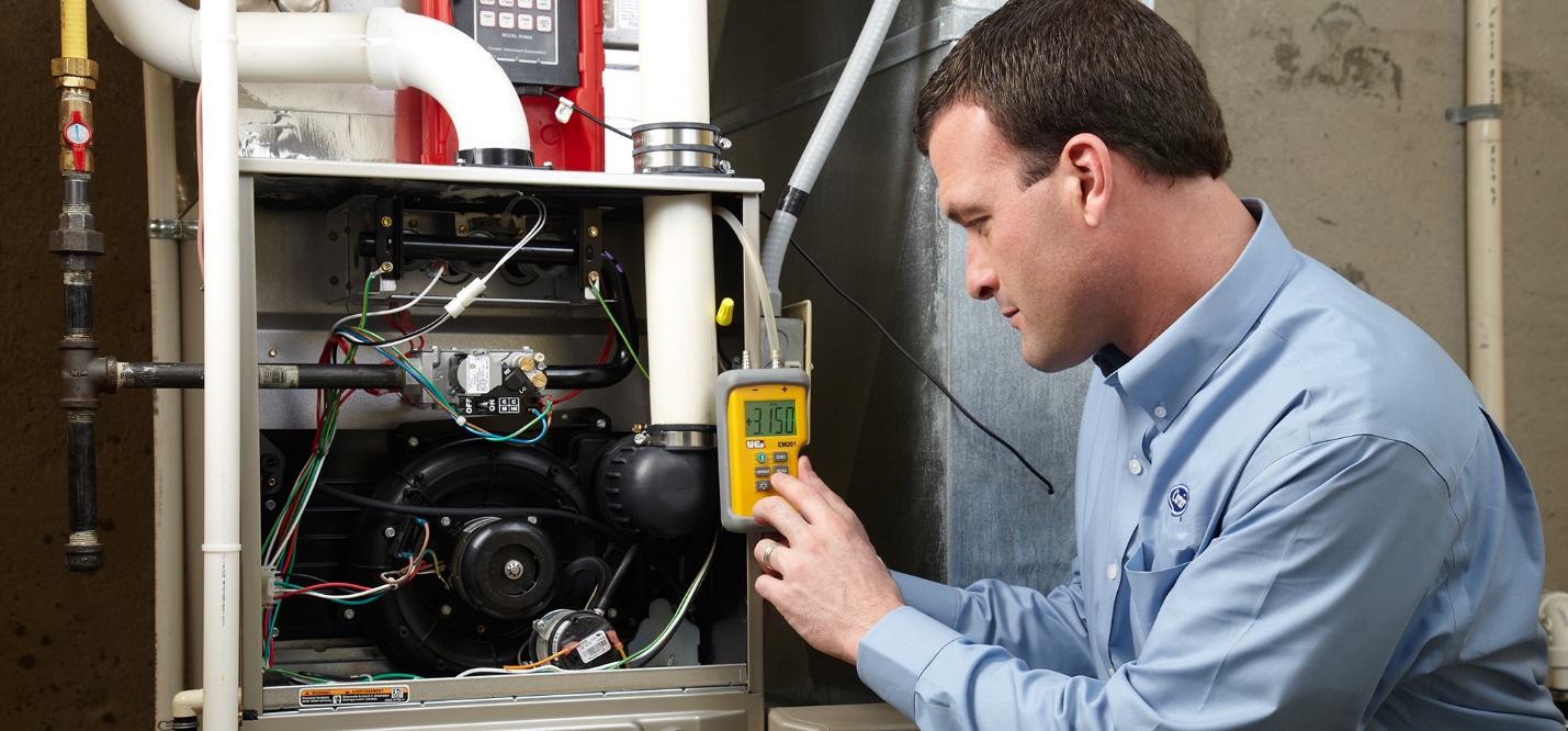 MC Air technician diagnosing a residential heating system